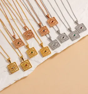 Macro detail of evil eye square pendants in gold and silver finish with colorful gemstones