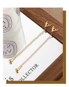 Elegant gold thread earrings with long tassel chains and small gold bead accents
