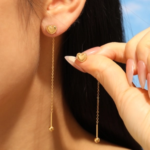 Elegant gold heart long chain earrings for women featuring minimalist aesthetic design
