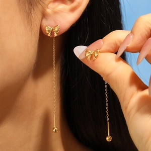 Elegant gold bow threader earrings with long chain tassel for women in fashion style