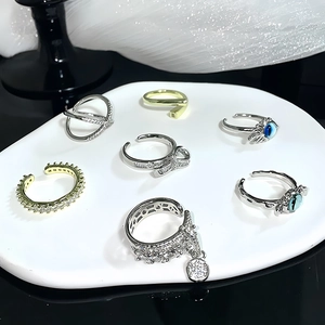7-piece set of evil eye and zircon open rings in silver and gold minimalist finishes