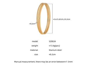 Macro detail of gold titanium steel triple bangles showing frosted and polished finishes
