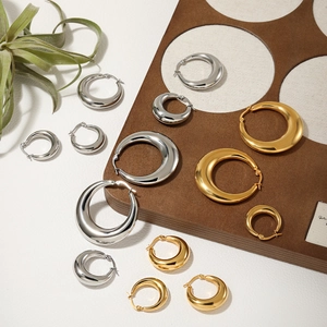 Minimalist gold and silver hoop earrings set in various sizes with high polished finish