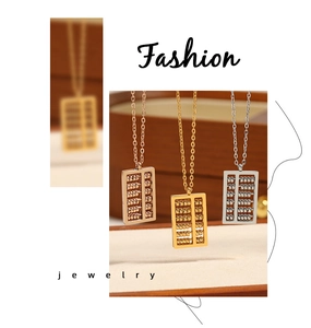 Detailed view of three mini abacus pendants in gold, rose gold and silver finishes