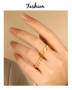 Close-up of golden Cuban chain ring in polished stainless steel for a street style look