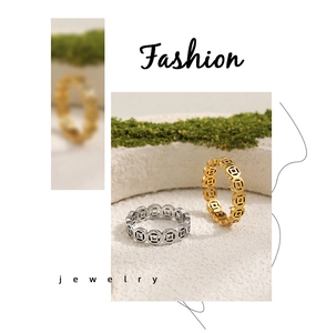 Detailed view of hollowed-out Chinese coin pattern rings in gold and silver finish