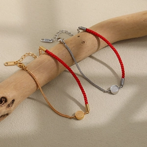 Traditional red cord and titanium steel FU pendant bracelet set on wooden branch