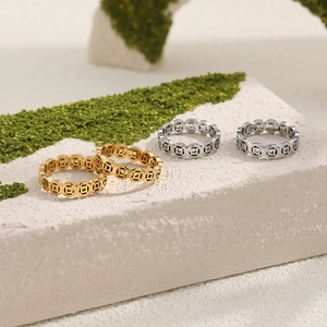Chinese style copper coin rings in gold and silver finish on natural stone