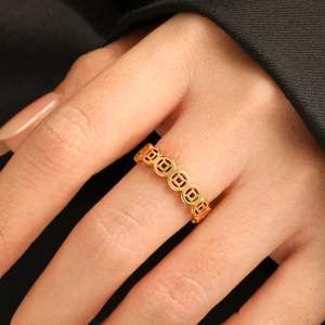 Polished 24K gold plated titanium steel ring with traditional Chinese coin pattern