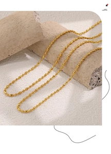 Detailed macro view of 18k gold plated beaded oval bamboo chain necklace links