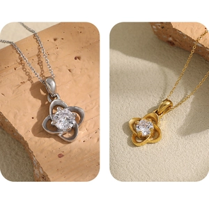 Detail of clover necklaces with sparkling zircon in gold and silver plating