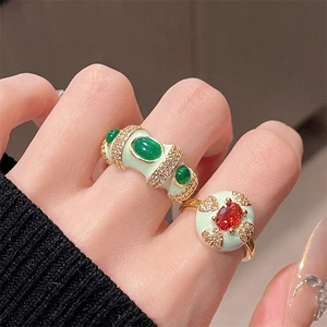 Mint green enamel ring with emerald-like gems and zircons on gold-plated band