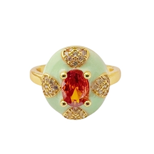 Mint green enamel open ring with heavy gold metal, orange zircon, and crystal accents