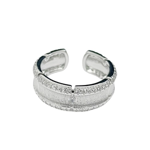 Silver brushed open ring with zircon inlay and sparkling crystal rows on white background