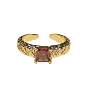 French vintage style open ring with square red gemstone and woven diamond gold band