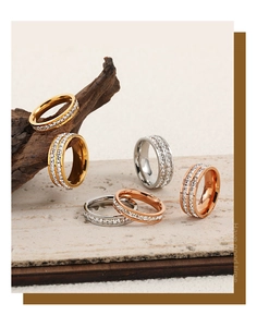 Close-up of gold and silver plated eternity rings with baguette diamonds on stone