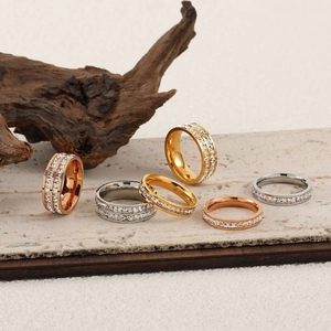 Fashionable gold-plated titanium steel rings with pavé set cubic zirconia rows