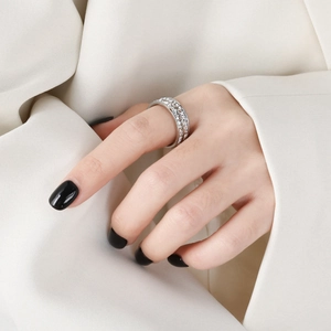 Elegant silver-toned eternity ring with double rows of sparkling crystals on a hand