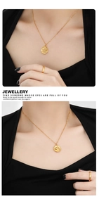 Close-up of 24K gold plated zodiac coin pendant necklace and minimalist stackable ring