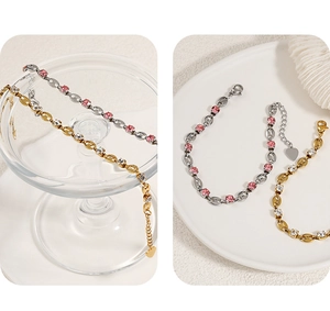 Detail of gold and silver coffee bean link bracelets with white and pink crystal pavé