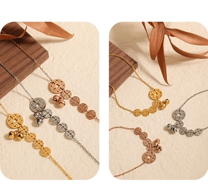 Detailed shot of gold, rose gold and silver ethnic anklets with ancient coin charms