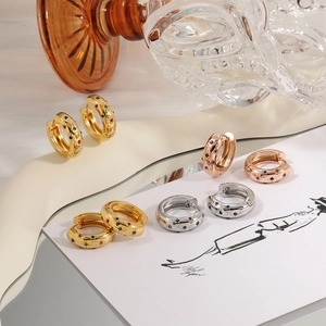 Thick stainless steel hoop earrings with colorful zircon star inlays in gold and silver