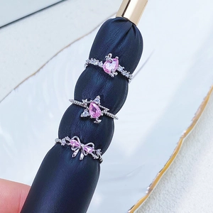 Three-piece silver ring set with pink heart, pear zircons and bow-knot designs