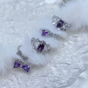 Luxurious purple zircon ring set with silver-tone butterfly and oval gemstone accents
