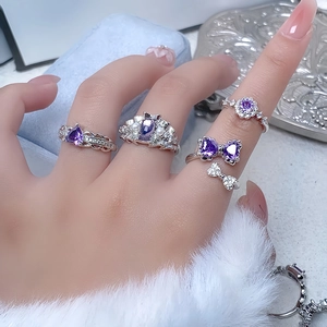 Luxurious purple zircon open rings set with heart and pear shapes on silver metal