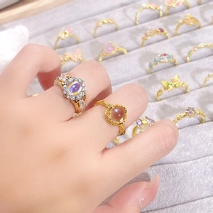 Detail of vintage enamel butterfly ring with gold plating and colorful zircons