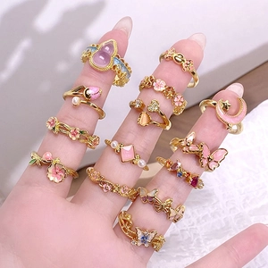 12-piece vintage enamel and zircon gold ring set with floral and butterfly motifs