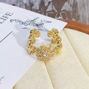 Detail shot of vintage gold flower ring with pave set crystals and adjustable band