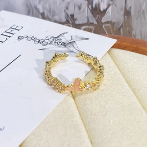 Detailed close-up of a vintage pink butterfly open ring with sparkling zircon accents