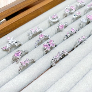 Silver rings set with pink zircon featuring butterfly and star designs for women