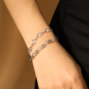 Silver double-layer titanium steel bracelet with oval embossed links and polished beads