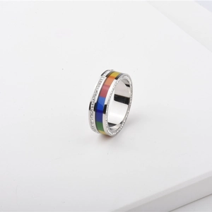 Detail of silver titanium ring featuring rainbow enamel tiles and double zircon pavé setting