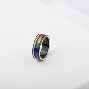 Close-up of titanium steel ring with rainbow enamel stripes and shimmering cubic zirconia