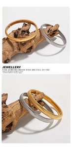 Macro shot of gold and silver snake bone elastic bracelets with spiral metal texture