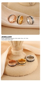 Detalle de anillos giratorios con números romanos y circonitas en tres terminaciones