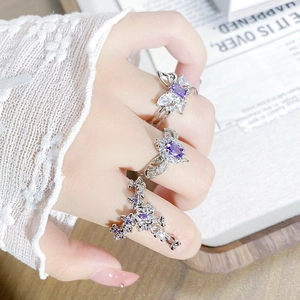 Elegant silver open ring set with purple zircon butterfly and oval gemstone designs