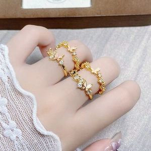 Gold butterfly ring set with zirconia and pink enamel detail for elegant women