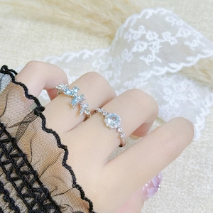 Floral butterfly open ring set with light blue zircons in elegant silver finish