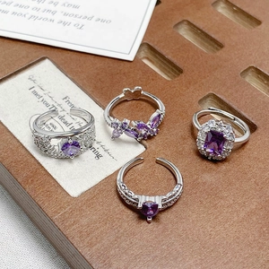 Adjustable silver ring set with purple zircon butterfly and heart shaped flower designs