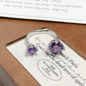 Detailed view of the purple zircon flower ring showing gemstone facets and silver finish