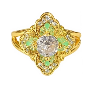 Vintage gold open ring with green enamel flower design and a large clear center stone