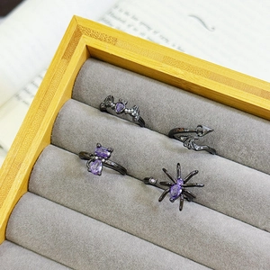 Gothic Halloween ring set with black bat spider cat designs and purple crystals