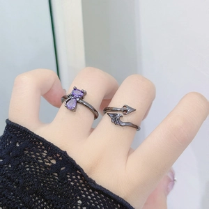 Macro view of black devil ring with purple cat zircon and bat wings elements
