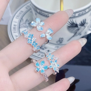 Chic floral enamel open ring set in silver with blue petals and zircon accents