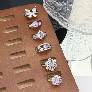 Set of six adjustable silver rings featuring purple zircon stones and butterfly motifs