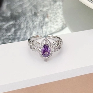 Detail view of purple oval zircon ring with micro-pave setting on silver open band